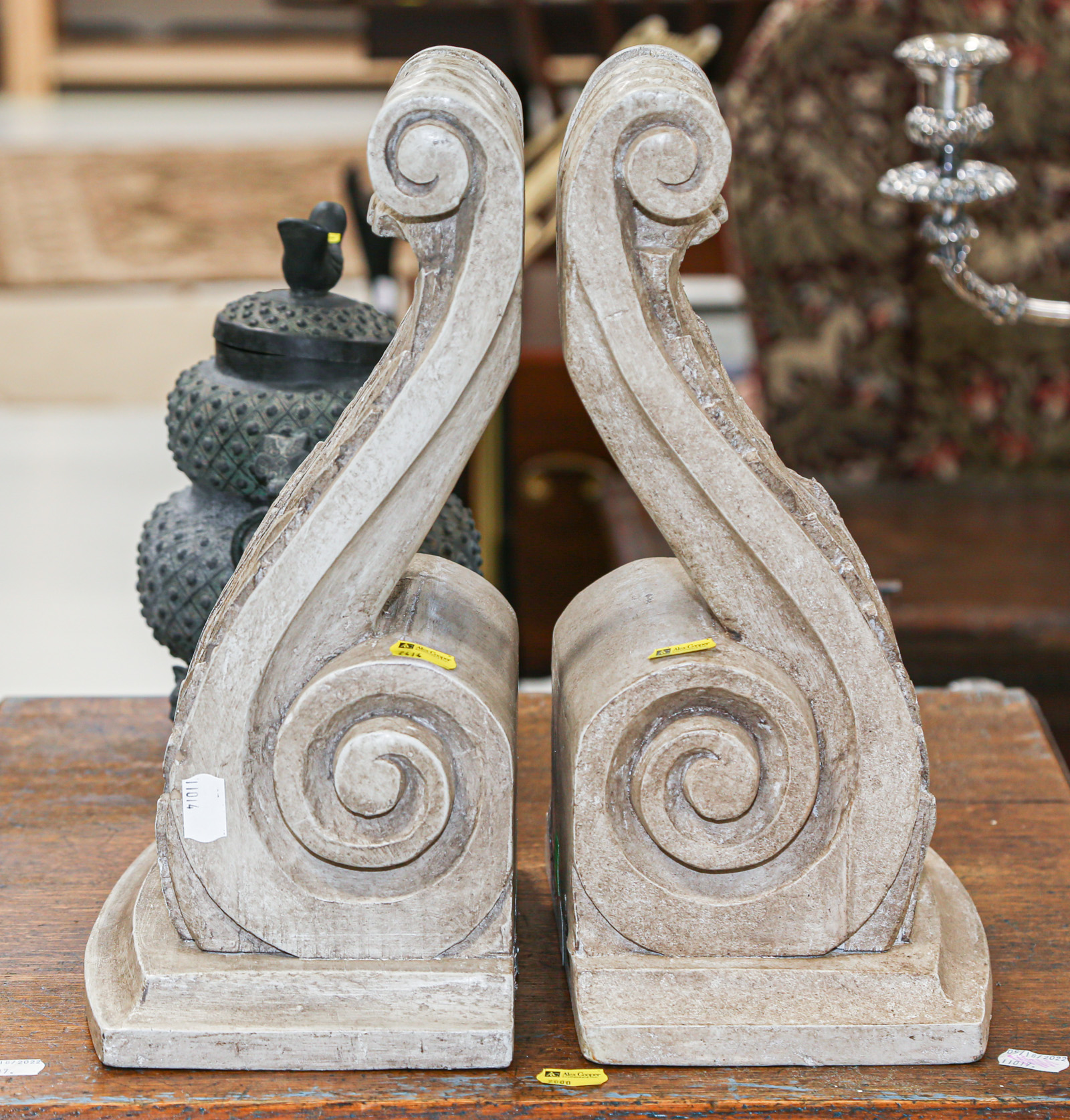 Appraisal: A PAIR OF COMPOSITION WALL BRACKETS in H in W