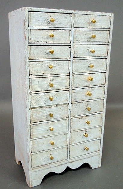 Appraisal: Blue painted pine multi-drawered storage chest th c with a