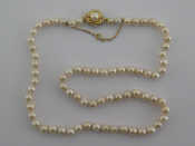 Appraisal: A cultured pearl necklace with a yellow metal tests carat