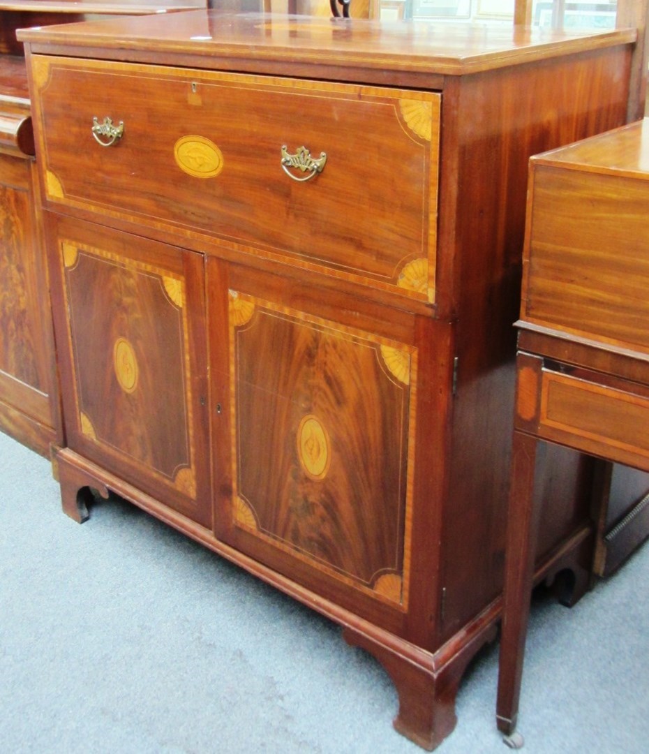 Appraisal: A late George III marquetry inlaid mahogany secretaire cupboard on