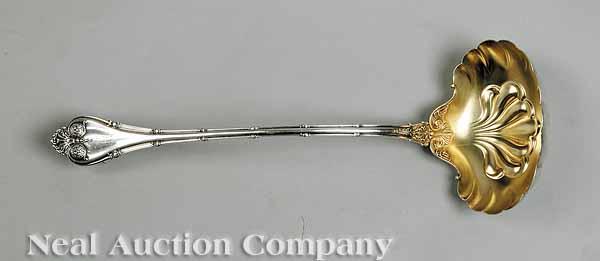 Appraisal: A Whiting Empire Sterling Silver Punch Ladle with shell-shaped gilt