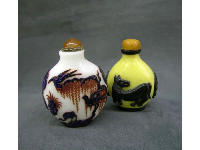 Appraisal: Two antique oriental snuff bottles one with onyx horse figures