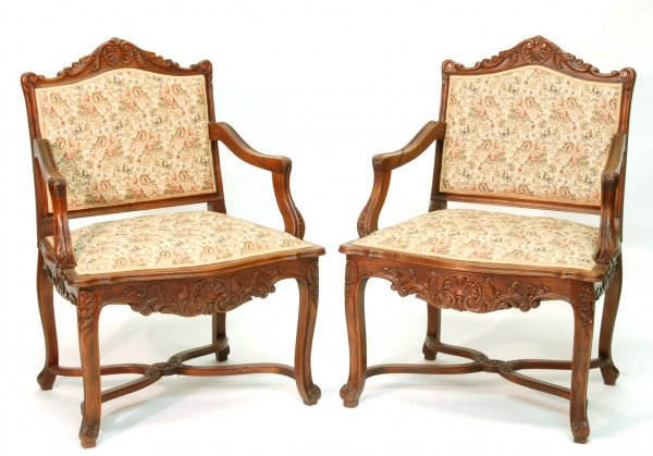 Appraisal: A pair of arm chairs Carved with shells and scrolling