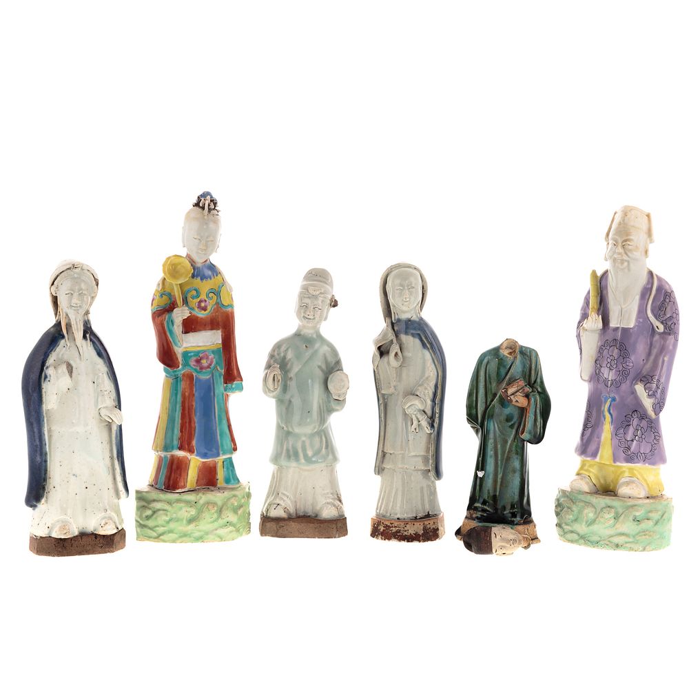 Appraisal: Chinese Earthenware Figures Porcelain Figures Two polychrome figures standing on