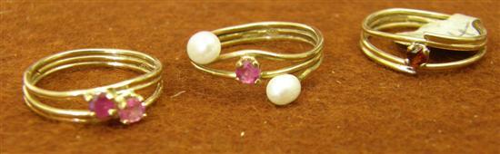 Appraisal: Three rings comprising two ruby set wire rings and a