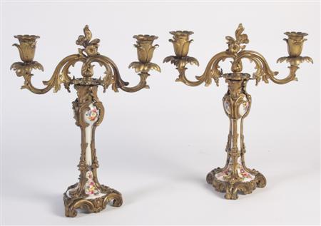 Appraisal: A pair of giltmetal and porcelain candelabra each with floral