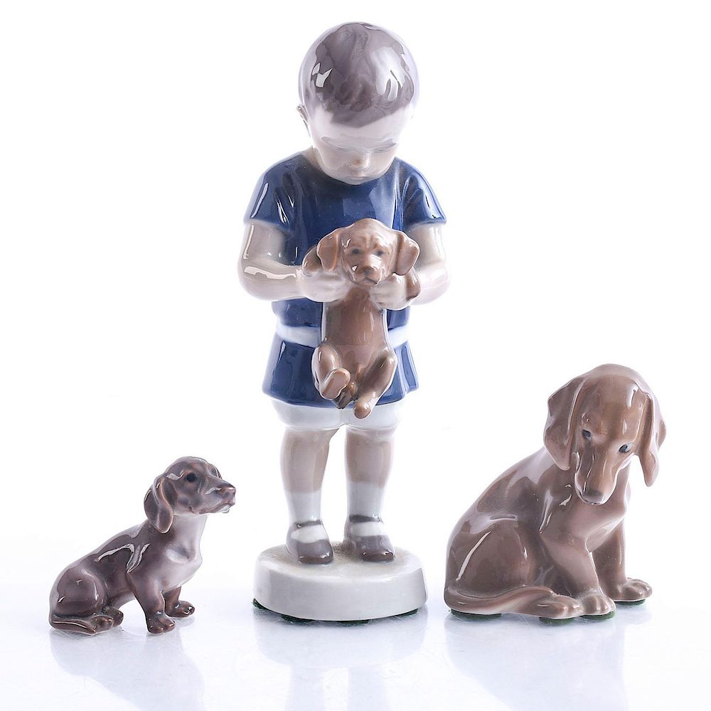 Appraisal: DUTCHHOUNDS AND LITTLE BOY HOLDING DUTCHHOUND Bing and Grondle figurines