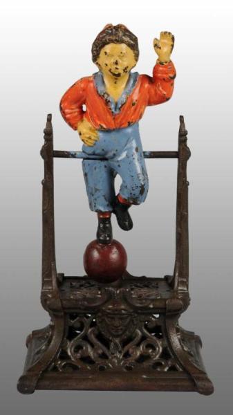 Appraisal: Cast Iron Boy on Trapeze Mechanical Bank Description Manufactured by