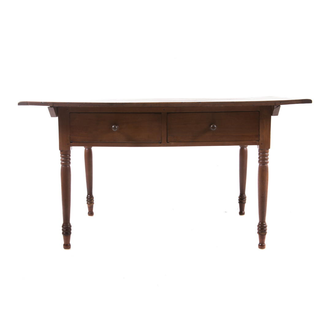 Appraisal: American Pennsylvania walnut tavern table th century -board overhanging top