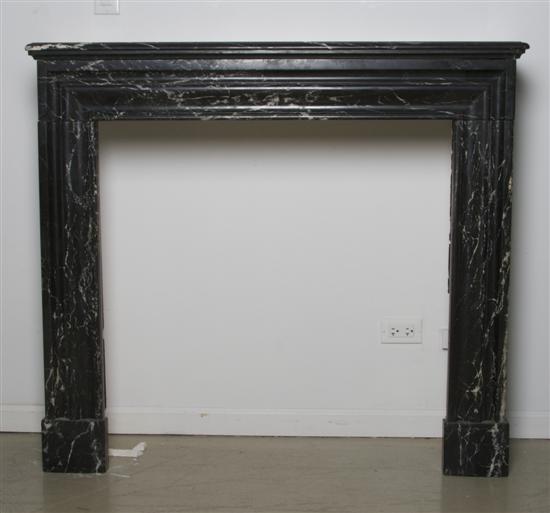 Appraisal: A Carved Black Marble Mantle Width inches