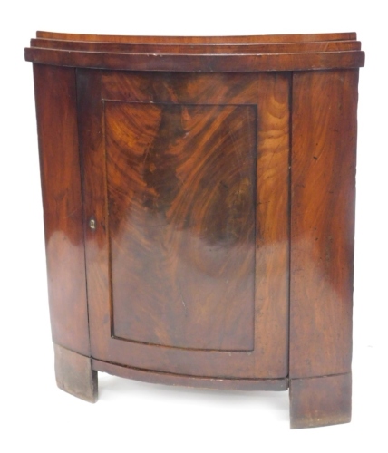 Appraisal: A thC figured mahogany standing corner cabinet with a stepped