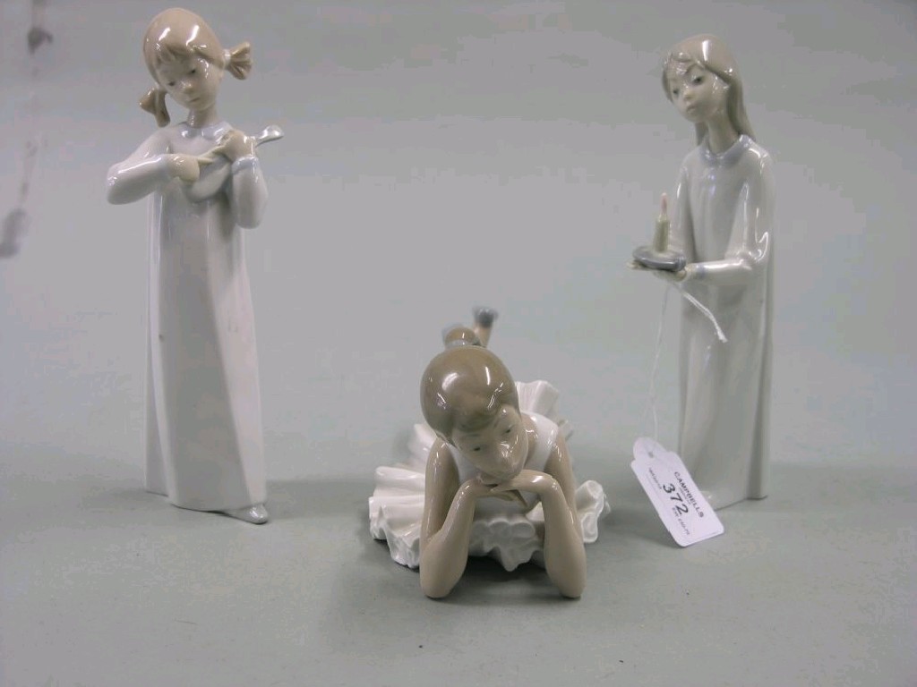 Appraisal: Three Lladro Nao figures girl lying girl with violin girl