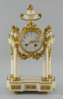 Appraisal: French white marble and gilt metal portico clock surmounted by