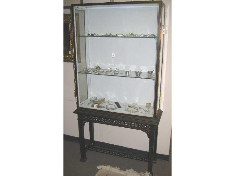 Appraisal: CHINESE CHIPPENDALE STYLE DISPLAY CASE Elaborately carved stand supporting the