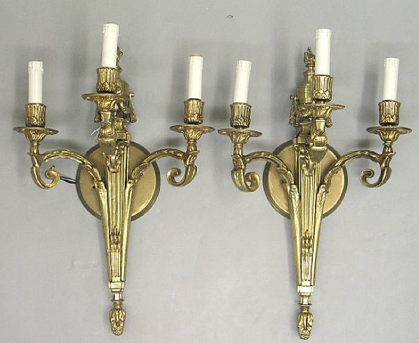 Appraisal: A pair of Neoclassical style brass wall sconces late th