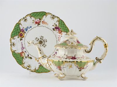 Appraisal: An H R Daniel rococo-moulded teapot and cover painted with