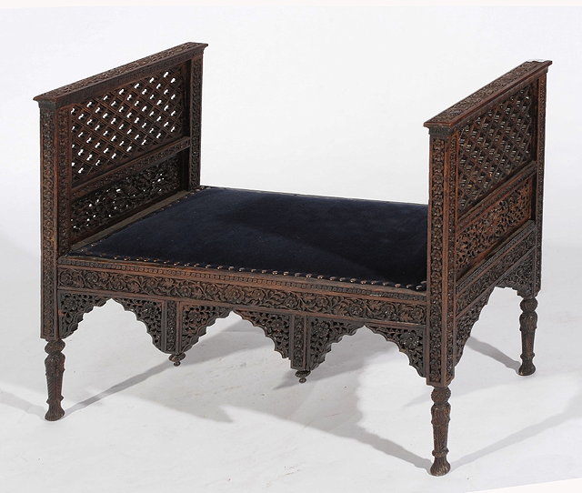 Appraisal: A KASHMIRI CARVED WINDOW SEAT with open fretwork sides cm