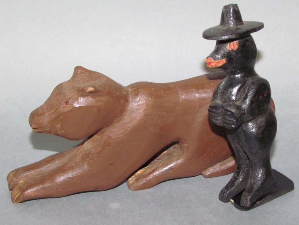 Appraisal: FOLK ART CARVINGSbrown cat chipped foot black painted bear with