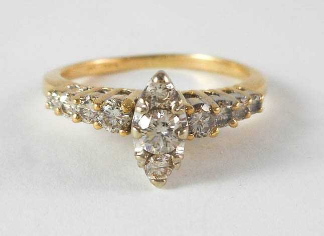 Appraisal: DIAMOND AND FOURTEEN KARAT GOLD RING set with eleven round-cut