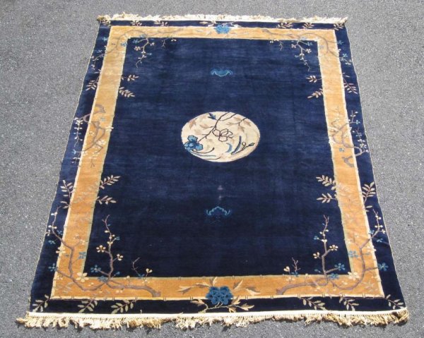 Appraisal: Chinese rug in midnight blue with designs MEASUREMENTS ' x