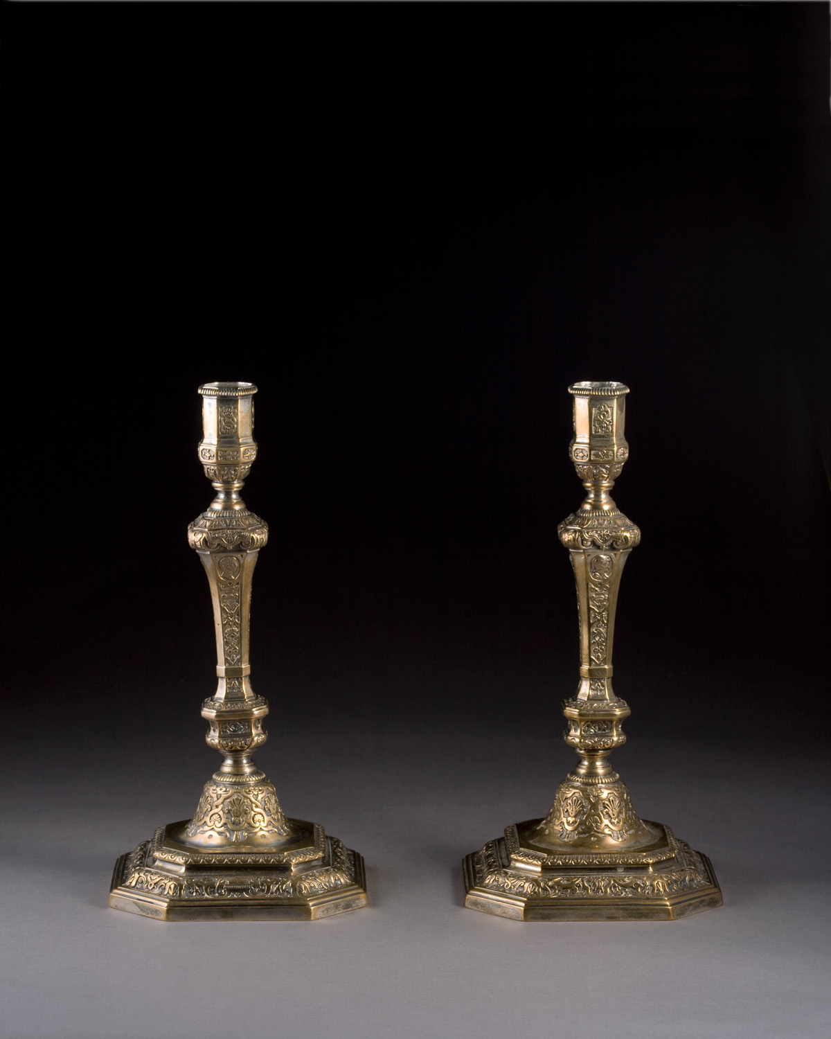 Appraisal: PAIR OF LOUIS XIV REGENCE GILT SILVERED-METAL CANDLESTICKS Each octagonal