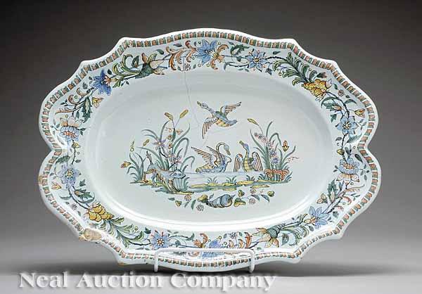 Appraisal: A Large Antique French Fa ence Platter with Boldly-Shaped Rim