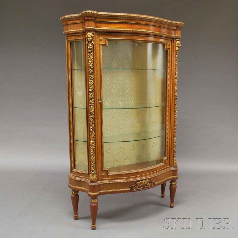 Appraisal: Louis XVI-style Mahogany and Parcel Gilt Vitrine the half serpentine