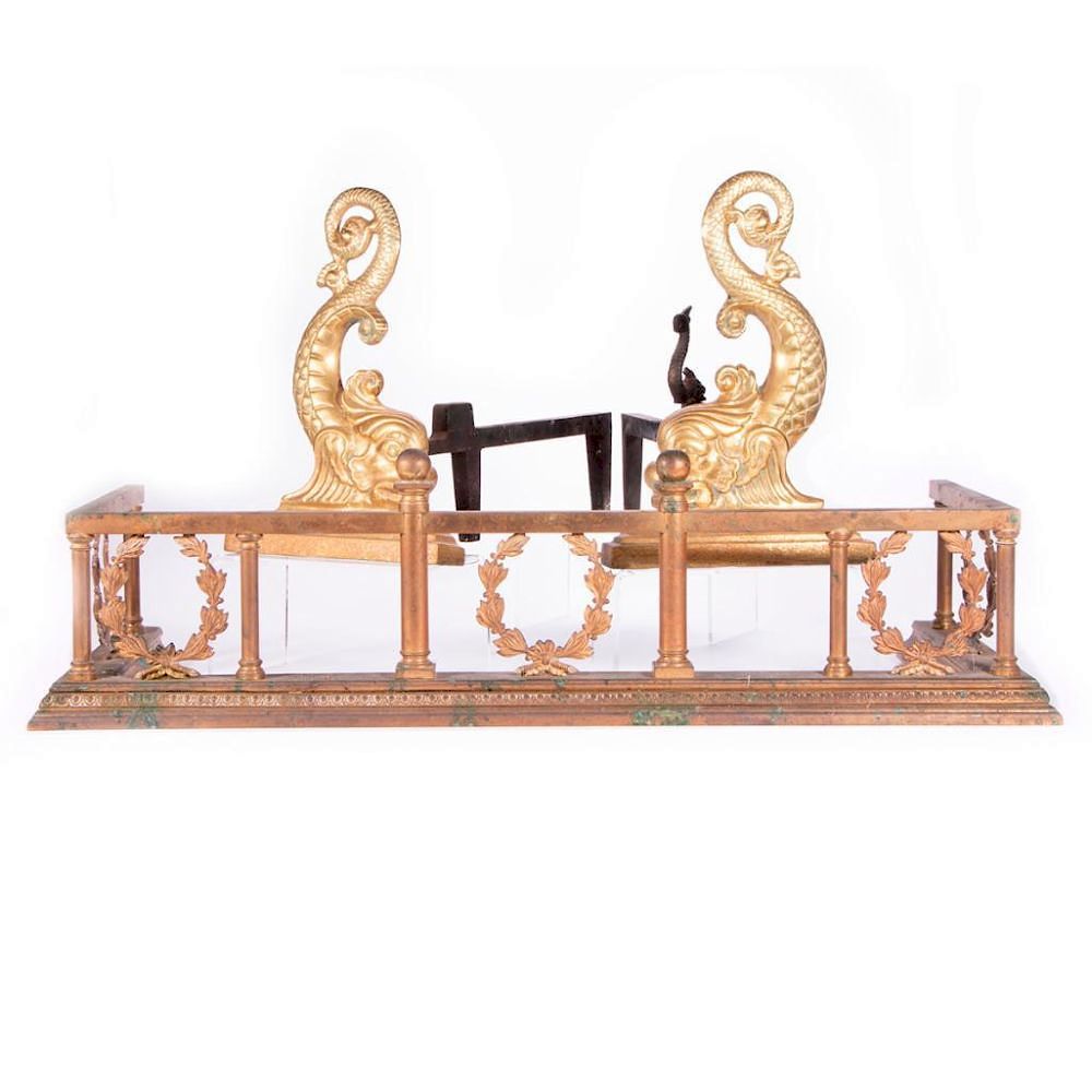 Appraisal: A brass and iron fireplace set with dolphin motif A