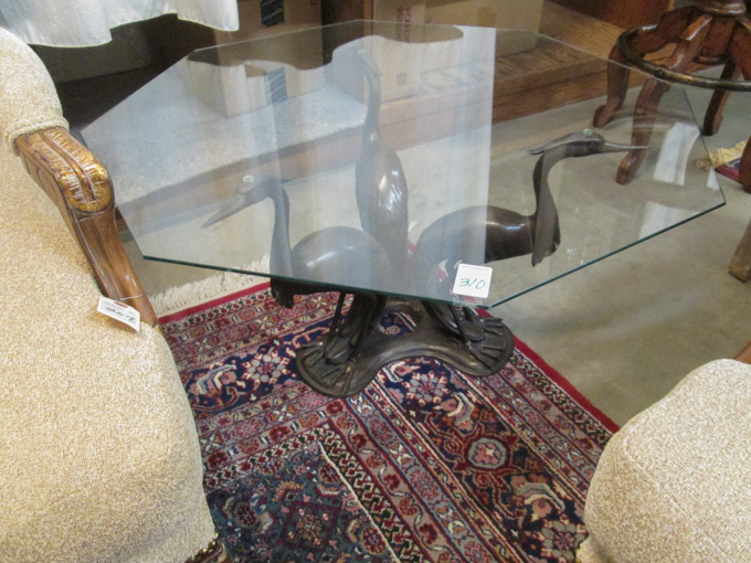 Appraisal: GLASS-TOP FIGURAL BRONZE COFFEE TABLE the octagonal clear glass top