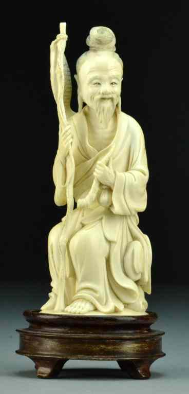 Appraisal: Chinese Qing Carved Ivory FigureFinely carved to depict a seated