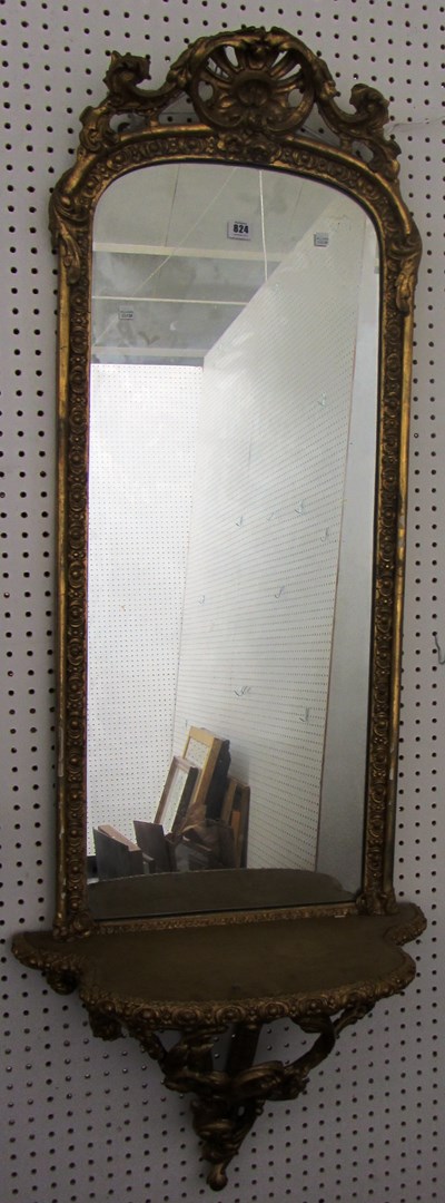 Appraisal: A Victorian gilt framed arch top pier glass with stylized