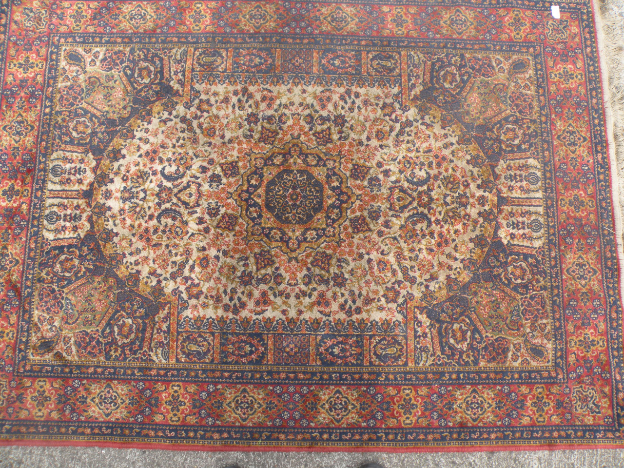 Appraisal: A thC Persian rug the rectangular body decorated with a