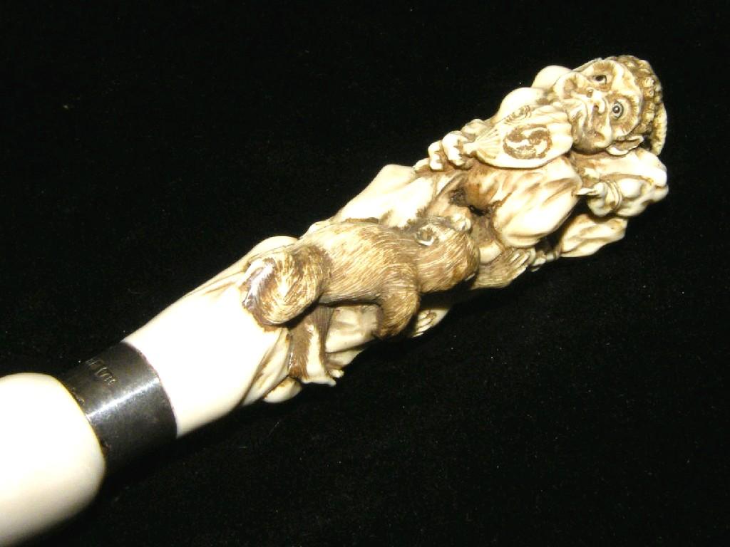 Appraisal: Japanese ivory page turner carved handle modelled as a hunched