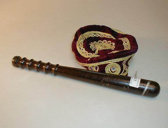 Appraisal: A truncheon and a bullion work velvet skull cap