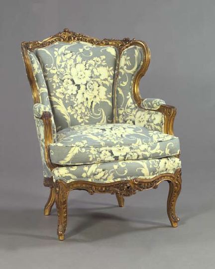 Appraisal: Louis XV-Style Giltwood Bergere with foliate and floral carving closed