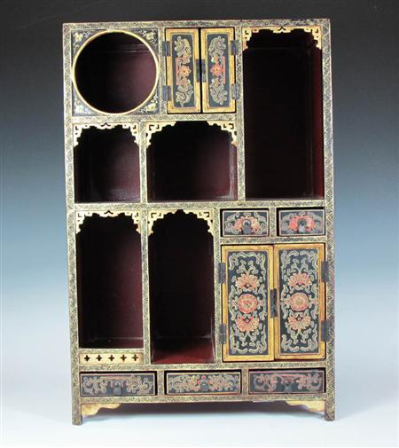 Appraisal: A Chinese painted lacquer display cabinet of tall rectangular form