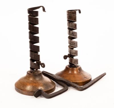 Appraisal: A pair of early th Century steel candlesticks with adjusters