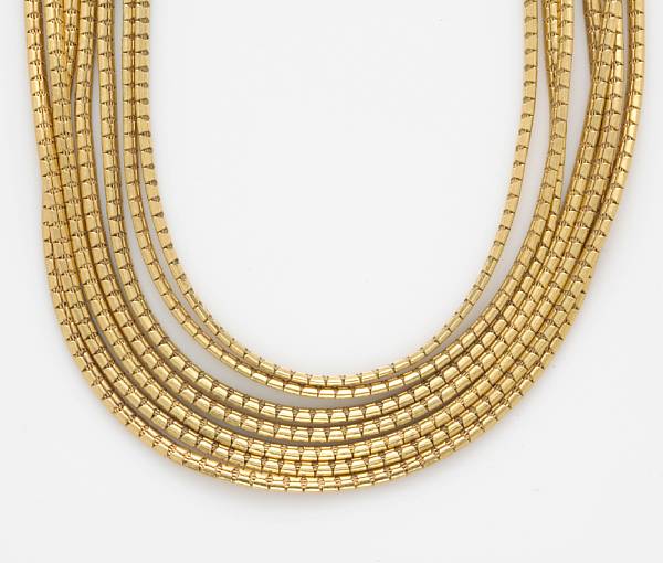 Appraisal: An eighteen karat gold seven strand necklace weighing approximately grams