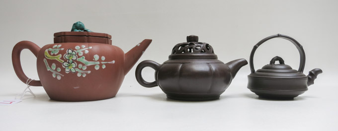 Appraisal: THREE CHINESE YIXING AND REDWARE TEAPOTS the largest with enamel