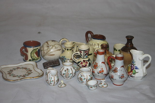 Appraisal: A COLLECTION OF MINIATURE DEVON POTTERY PIECES and a few