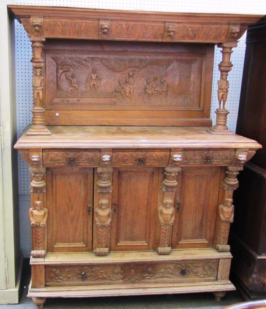 Appraisal: A th century oak cupboard profusely carved all over with