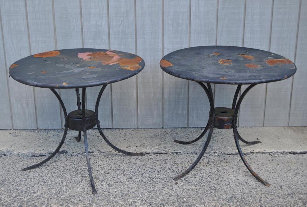 Appraisal: Two Wrought Iron Round Garden Tables with sheet metal tops