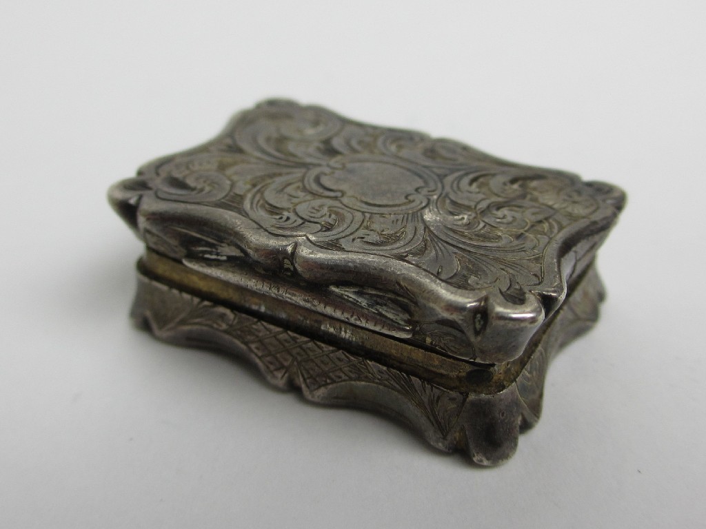 Appraisal: A Victorian silver vinaigrette chased with foliage maker TD cm