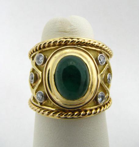 Appraisal: k yellow gold cabochon emerald and tw diamond wide band