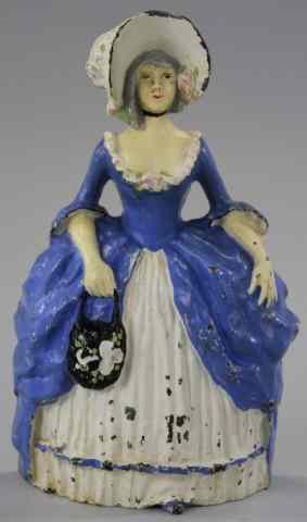 Appraisal: COLONIAL LADY DOORSTOP Cast iron colorful painted variation charming depiction