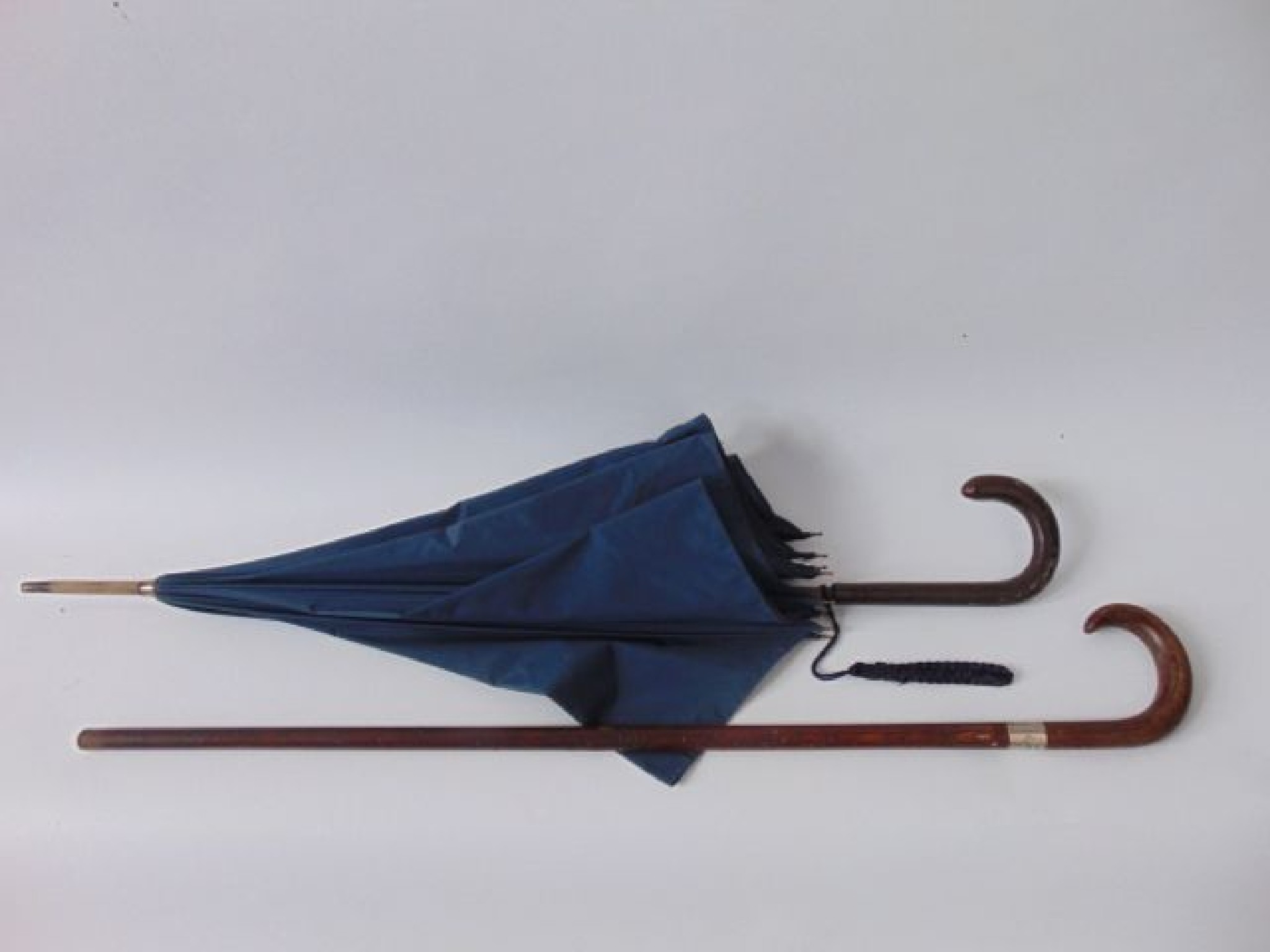 Appraisal: An early th century ladies parasol with stitched snakeskin handle