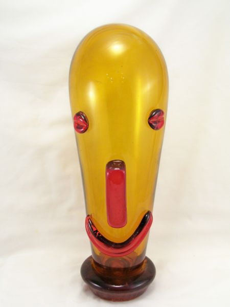 Appraisal: Art Glass Clown Head Elongated amber glass head with applied