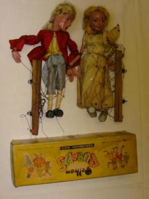 Appraisal: A Pelham standard puppet box yellow containing two puppets Prince