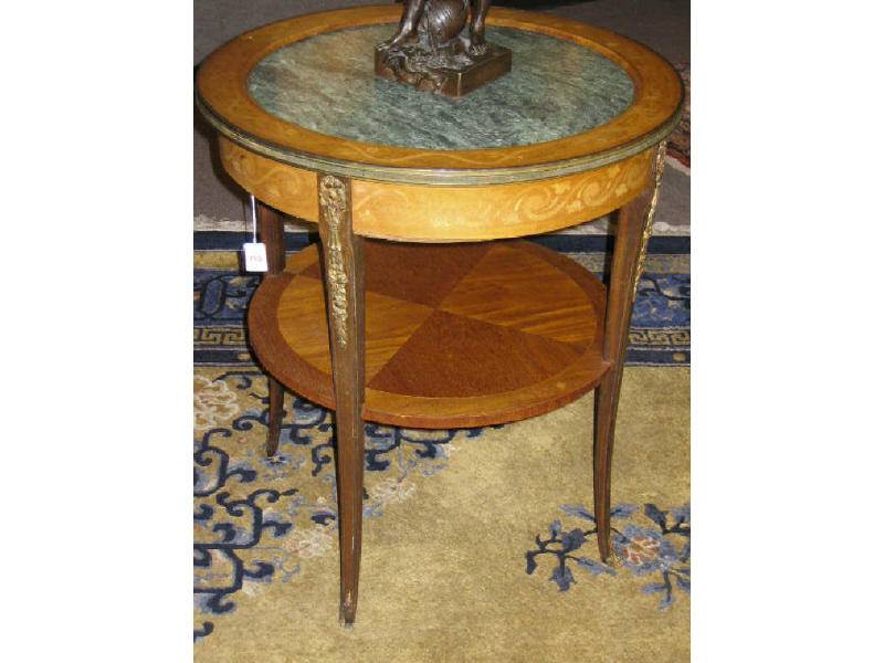 Appraisal: CONTINENTAL MARQUETRY AND MARBLE TOP CENTER TABLE Circular gilt bound