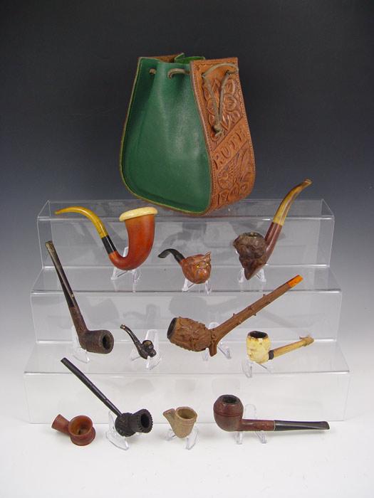 Appraisal: COLLECTION OF VINTAGE PIPES Includes wooden carved heads cat floral